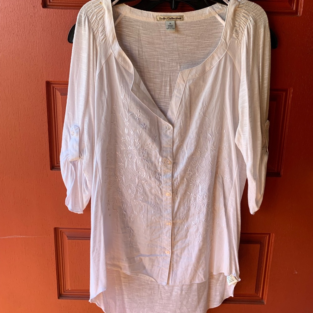 White top with embroidery details